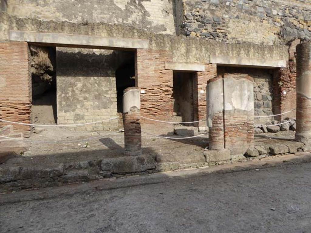 Decumanus Maximus, Herculaneum, October 2014. Building on north side of the Decumanus Maximus, doorway numbered 8, on left, number 9, centre right, and number 10, on right. Photo courtesy of Michael Binns.